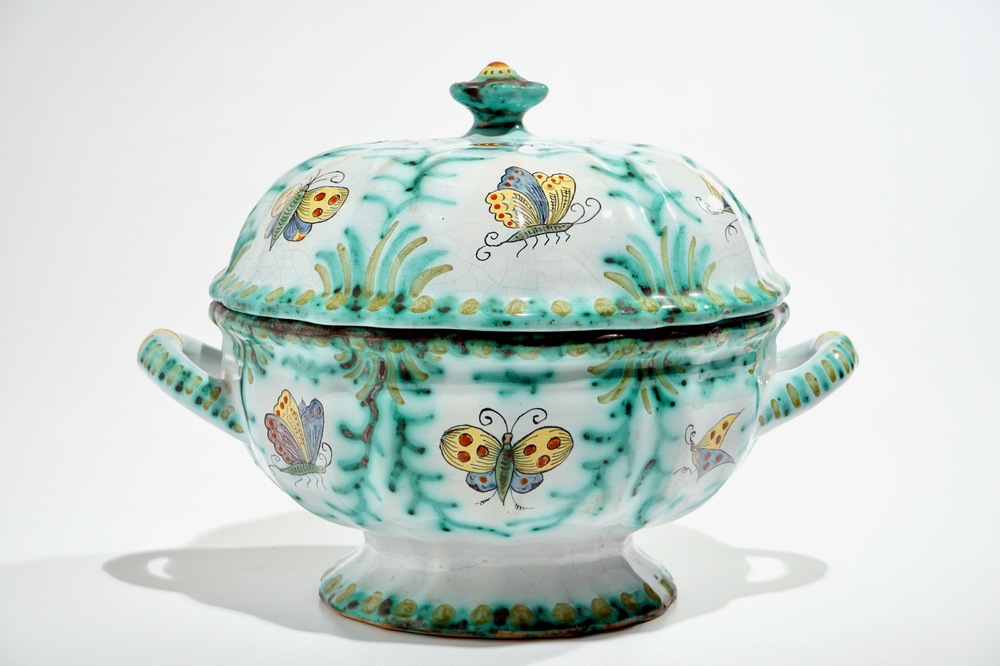 A polychrome Brussels faience tureen and cover with butterflies and caterpillars, 18/19th C.